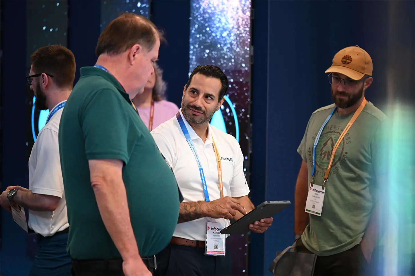 Marcos Martinez interacts with attendees in the PixelFLEX booth at the InfoComm trade show