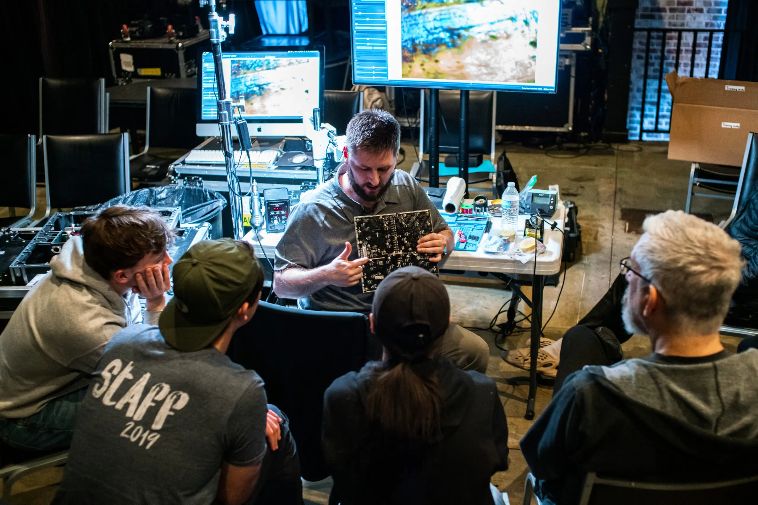 PixelFLEX employee providing product training session for AV integrators on LED display technology.